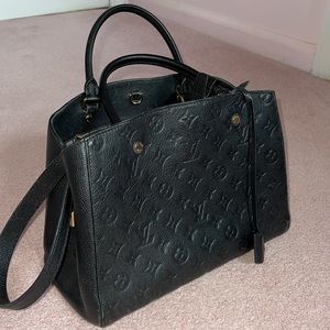 Authentic LOUIS VUITTON
BLACK MONOGRAM EMPREINTE MONTAIGNE MM
